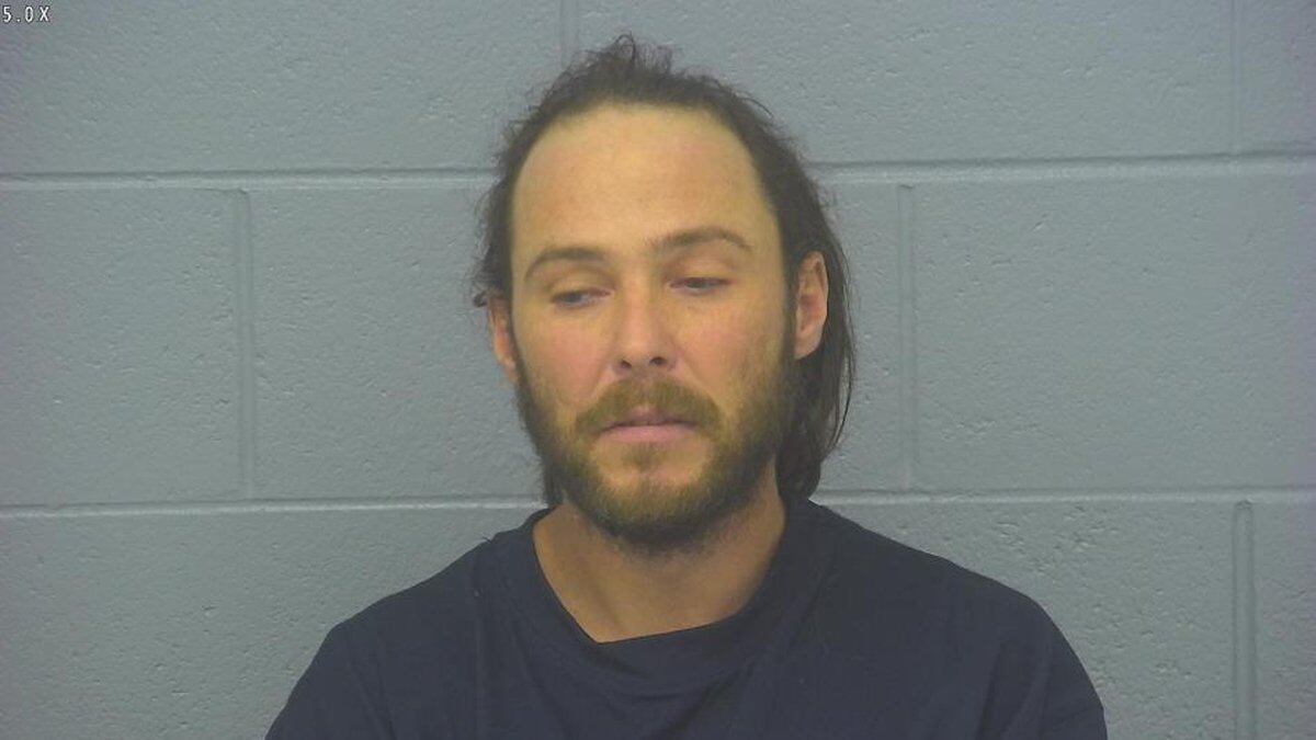 Springfield man charged with assaulting a person while claiming to be a