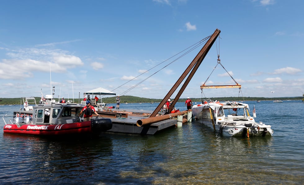 The duck boat that sank in Table Rock Lake in Branson, Mo., is raised Monday, July 23, 2018....